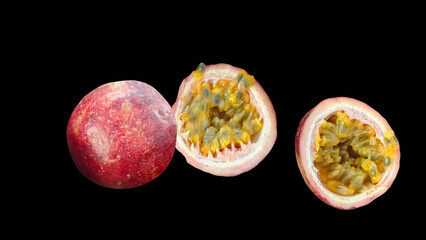 Fresh passion fruit isolated on black background.