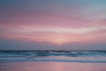 Fototapeta premium Pink Purple Sunset Sky Over Ocean With Calm Waves at Beach