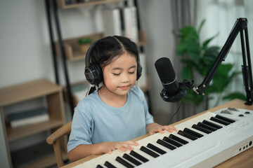 Young Girl Playing Keyboard in Home Studio Environment with Headphones and Microphone, Embracing Passion for Music and Creativity © WMSTUDIO