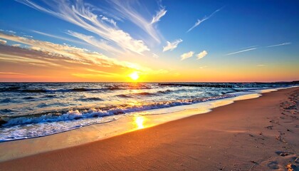 A breathtaking sunset paints the vibrant ocean with warm hues, casting a golden glow on the tranquil beach.