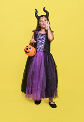 Smiling girl wearing witch costume  for Halloween