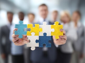 A photo of diverse business people holding puzzle pieces together, symbolizing collaboration and teamwork for success in the corporate world. High quality