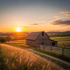 Obraz premium Rustic barn stands peacefully in a golden field at sunset in the countryside scene