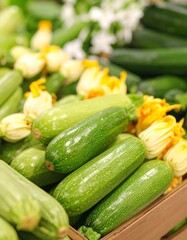 Fresh zucchini in a wooden crate