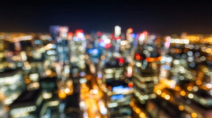A vibrant city skyline at night, featuring a blend of blurred lights and colors, creating a dynamic urban atmosphere.