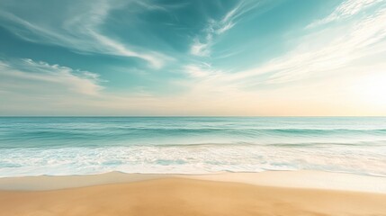 A serene beach scene with soft waves lapping against golden sand under a bright blue sky, creating a tranquil and inviting atmosphere.