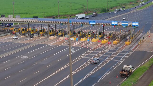 Workers Operating Machinery Applying Asphalt on Road Construction