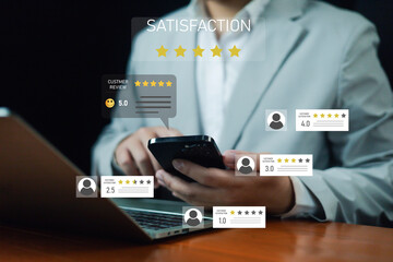 Businessman using smartphone and laptop with customer review ratings and satisfaction stars,...