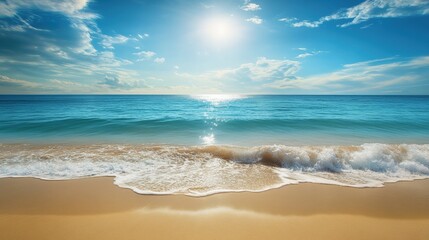 Obraz premium A serene beach scene showcasing gentle waves lapping the golden shore under a bright blue sky with fluffy clouds and sunlight reflecting on the water.