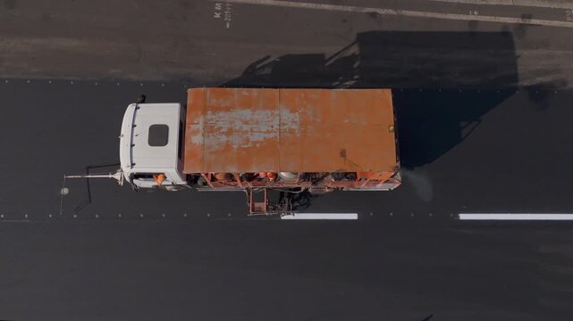 Workers Operating Machinery Applying Asphalt on Road Construction