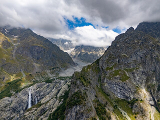 Waterfall cascading down rocky mountainside in Mestia, Georgia