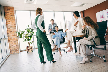 Collaborative brainstorming session among business professionals in a bright modern office setting...