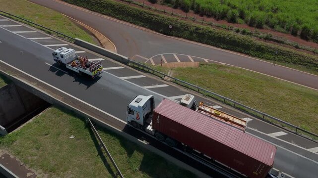 Workers Operating Machinery Applying Asphalt on Road Construction