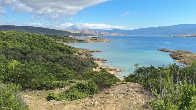 Panorama of the coast on the island of Rab, sandy beaches for FKK, viewpoint with a bench

