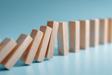 Wooden domino effect falling down Rising unemployment and GDP crisis. Business concept.