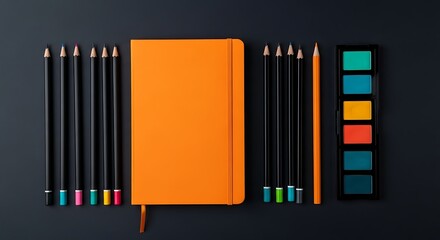 Obraz premium Overhead view of an orange notebook surrounded by black pencils and a colorful eyeshadow palette on a dark background, symbolizing creativity and art supplies