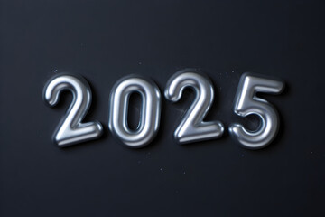 Shiny silver 2025 balloons creating a festive new year celebration design