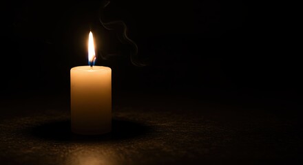 Glowing Candle Burning with Smoke on Dark Background