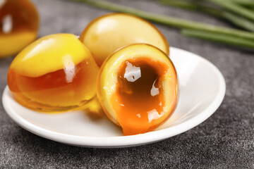 Soft-boiled eggs with runny golden yolks on white plate - perfect breakfast cooking technique