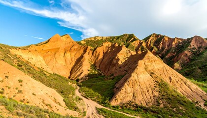 Naklejka premium Colorful mountain landscape under a partly cloudy sky