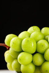 Fresh Green Grapes with Water Droplets on Dark Background