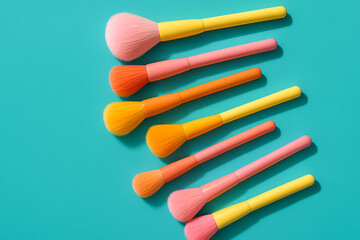 Naklejka premium Vibrant Makeup Brushes Set on Bright Blue Background