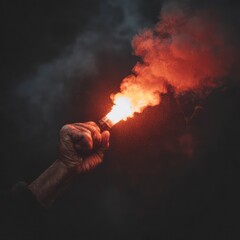 A burning firecracker in a man's hand, close-up photo, gloomy dark surroundings, focus on the object
