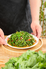 Organic Wild Green Salad with Fresh Herbs and Vegetables on White Plate - Healthy Natural Food