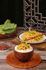 Stir-Fried Pork with Peppers and Chili Over Rice in Wooden Bowl - Asian Cuisine