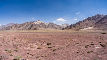 Scenic high altitude desert mountain landscape view along M41 aka Pamir Highway in summer, Murghab, Gorno-Badakhshan, Tajikistan
