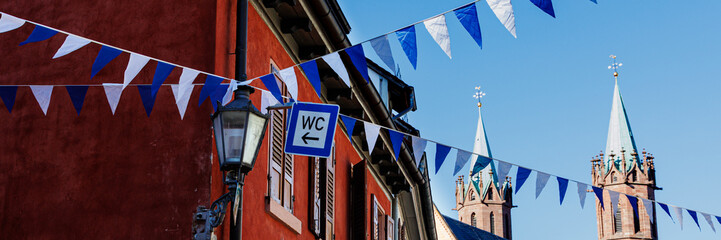 Oktoberfest decoration in the streets of old German town. Street with traditional Houses and...