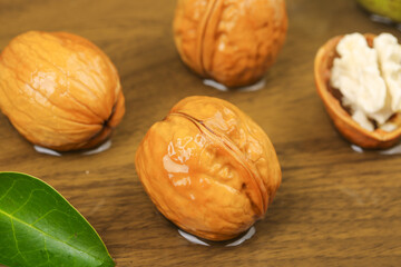 Fresh Walnuts with Green Leaves on Wood - Healthy Natural Nuts Studio Photography