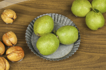 Fresh Limes and Walnuts on Wooden Table - Healthy Organic Ingredients Studio Photography