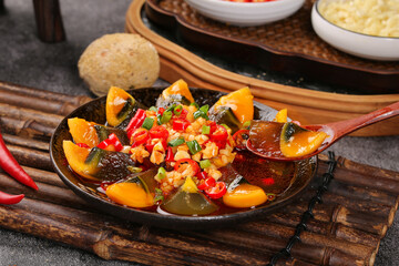 Chinese Preserved Century Eggs with Peppers Traditional Asian Appetizer Dish on Bamboo Placemat