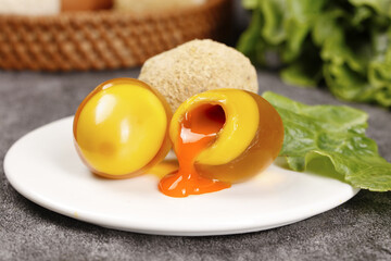 Soft-Boiled Eggs with Golden Runny Yolks and Fresh Greens on White Plate