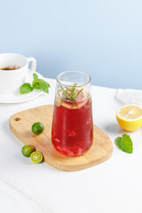 Fresh Red Grape Juice with Mint and Citrus on Wooden Board Summer Drink Scene