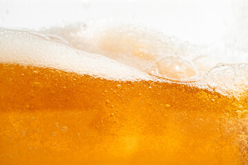 Close up bright orange Oil or beer splash texture and nature waves, Beautiful waves curve and little bubbles smooth for graphic design and background, Oil Bubbles, Soft beer bubbles, Selective focus