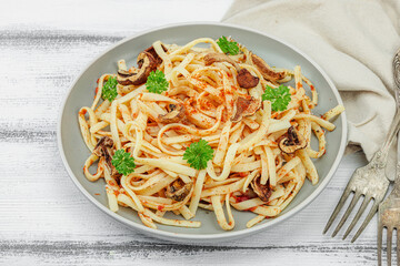 Plant based pasta with tomato sauce, herbs and cheese. Ready to eat healthy vegan food