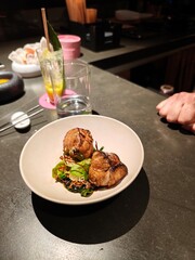 Delicious seared scallops with fresh greens served in a modern restaurant setting ready to be enjoyed