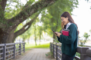 Students playing with mobile phones and laughing