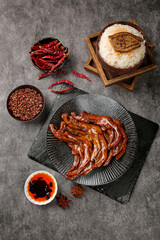 Spiced Marinated Duck Feet with Rice and Traditional Asian Sauce for Authentic Dinner