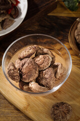 Dried Shiitake Mushrooms in Glass Bowl on Wooden Board - Still Life Kitchen Ingredients
