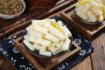 Pickled lotus root slices with hot chilli pepper and mixed spicy condiments traditional Asian appetizer
