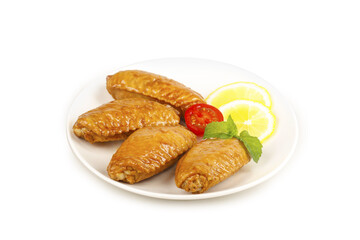 Salt-Baked Chicken Wings with Lemon Garnish on White Background