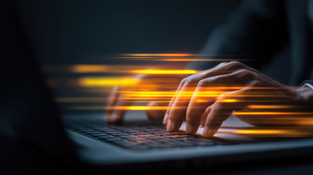 Fast typing on laptop keyboard creates sense of urgency and productivity. blurred motion effect emphasizes speed and efficiency in modern workspace