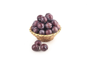 Fresh Red Plums in Wicker Basket Isolated on White Background