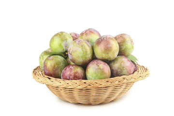 Fresh Green and Red Plums in Wicker Basket on White Background