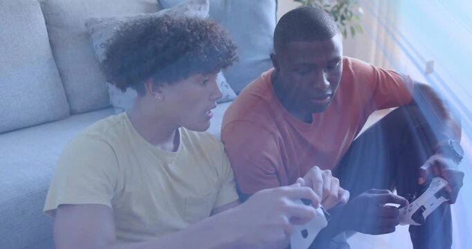 Two friends initiating gaming by tapping controllers on couch, generating animated strategy guides