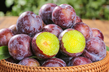Fresh Red Plums with Green Flesh in Wicker Basket - Ripe Stone Fruit Display