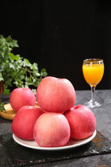 Fresh Red Fuji Apples from Qixia Display with Orange Juice Glass Healthy Fruit Arrangement